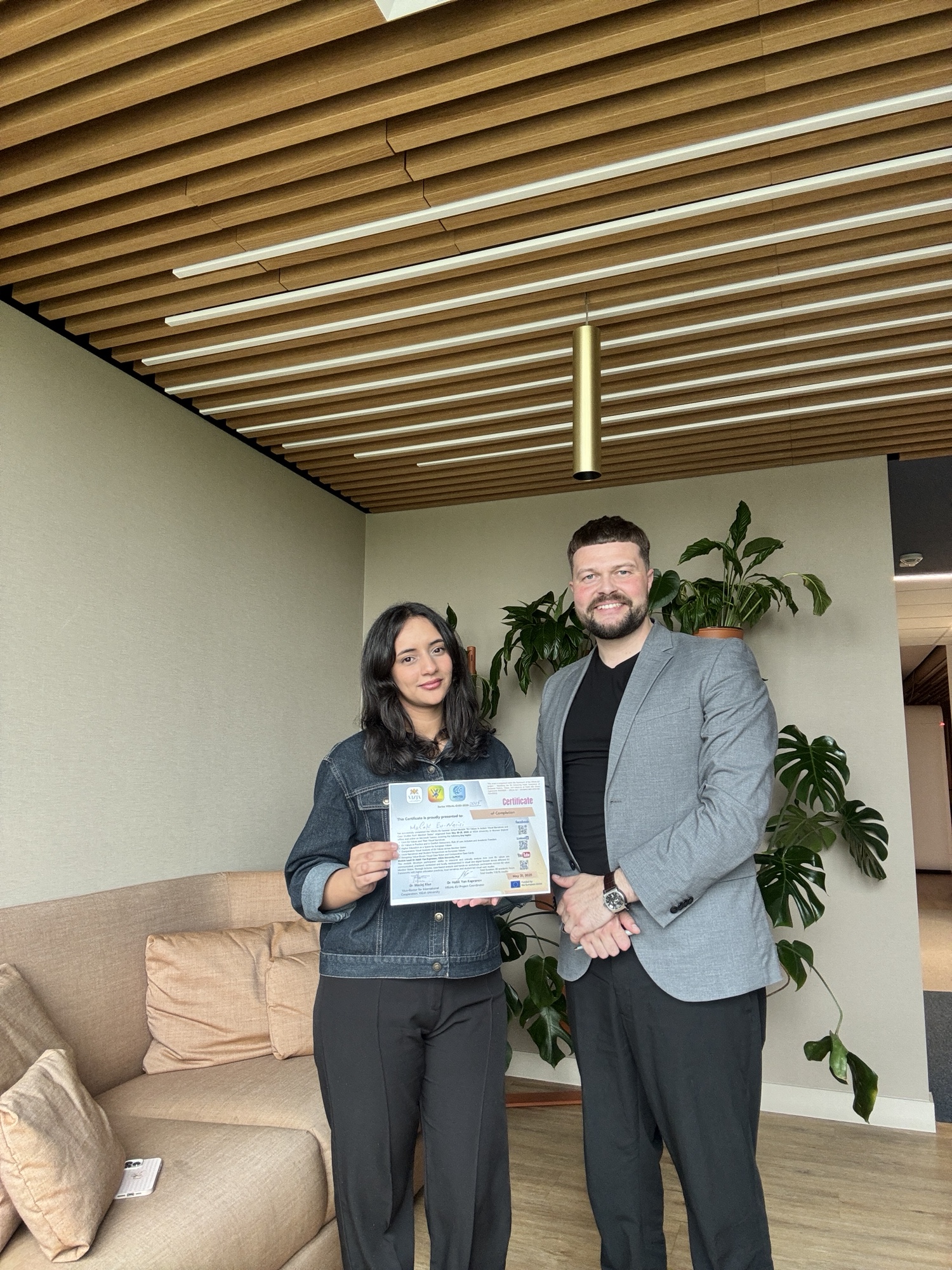 Summer School participant receiving a certificate